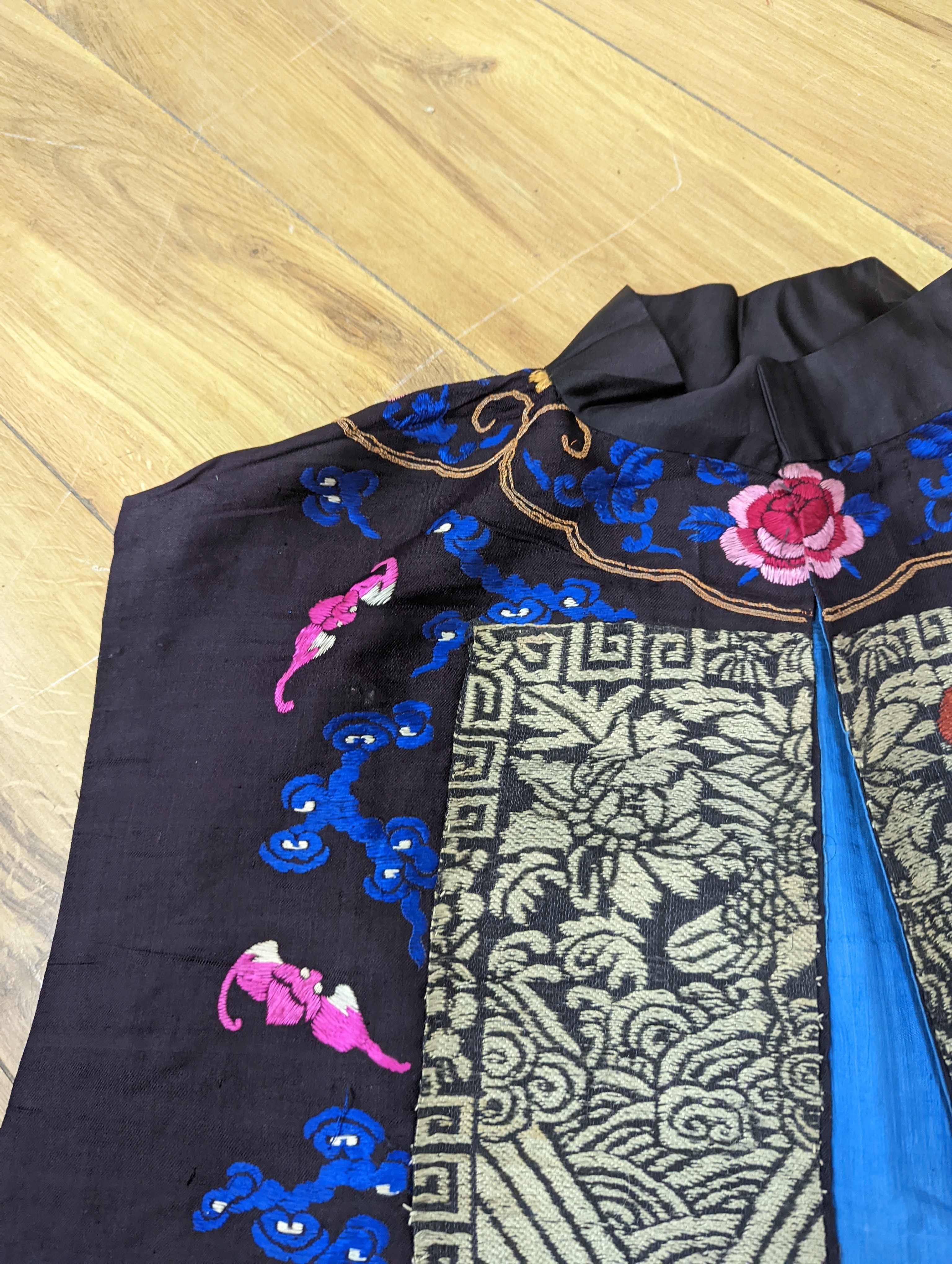 A 1920's Chinese dragon embroidered waistcoat, a cream silk drawn thread dress and a silk crepe black and patterned reversible kimono (3 items).